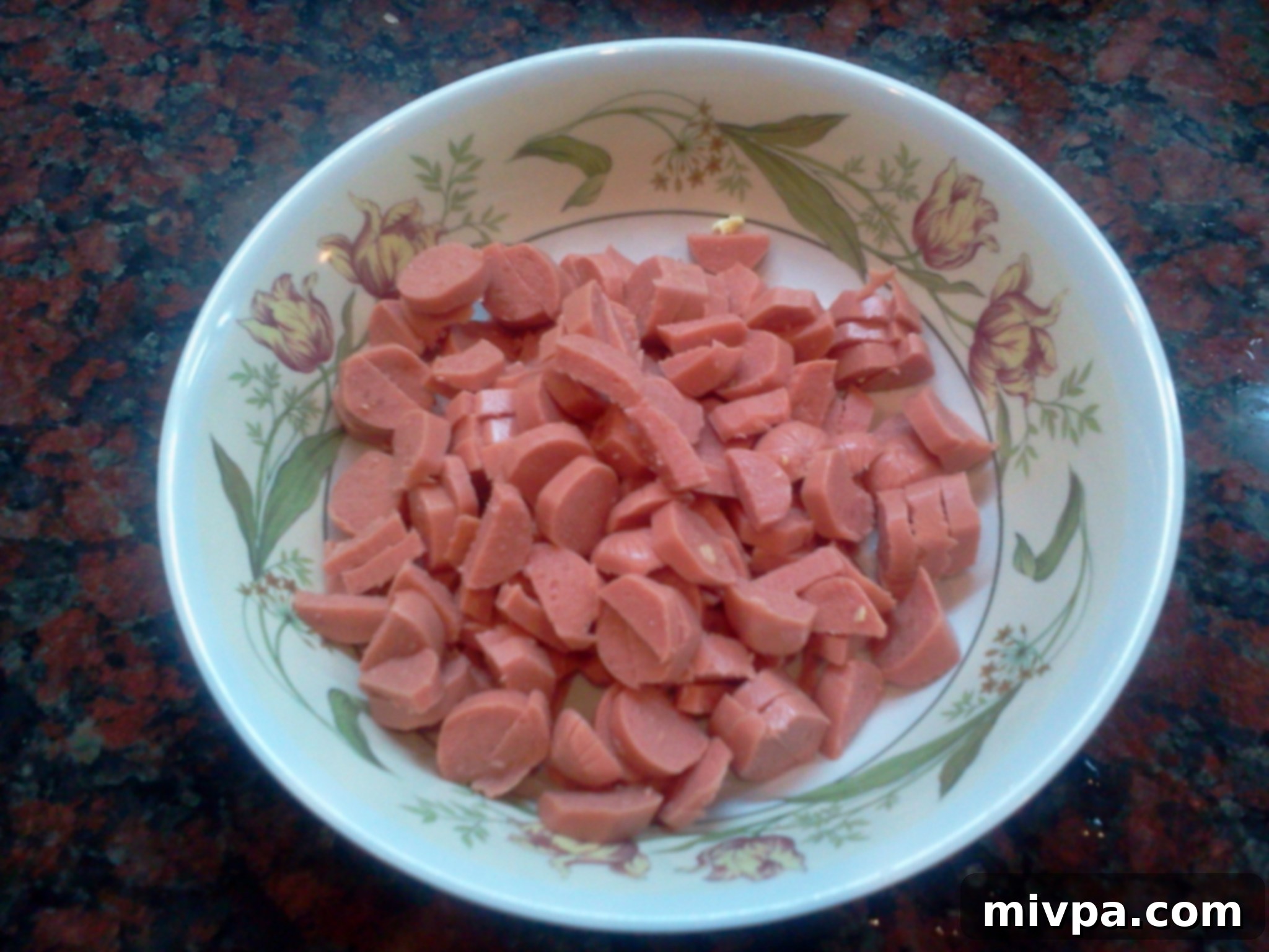 Chicken sausages sliced into small, even pieces, ready for cooking in the fried rice.