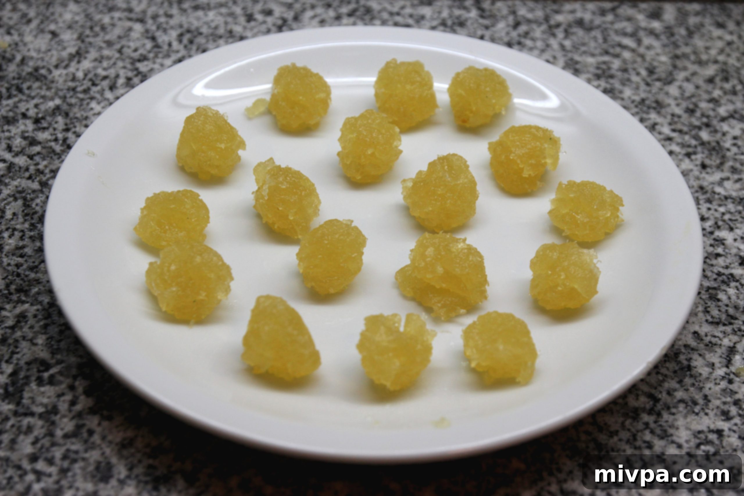 Rolling cooled pineapple paste into small balls