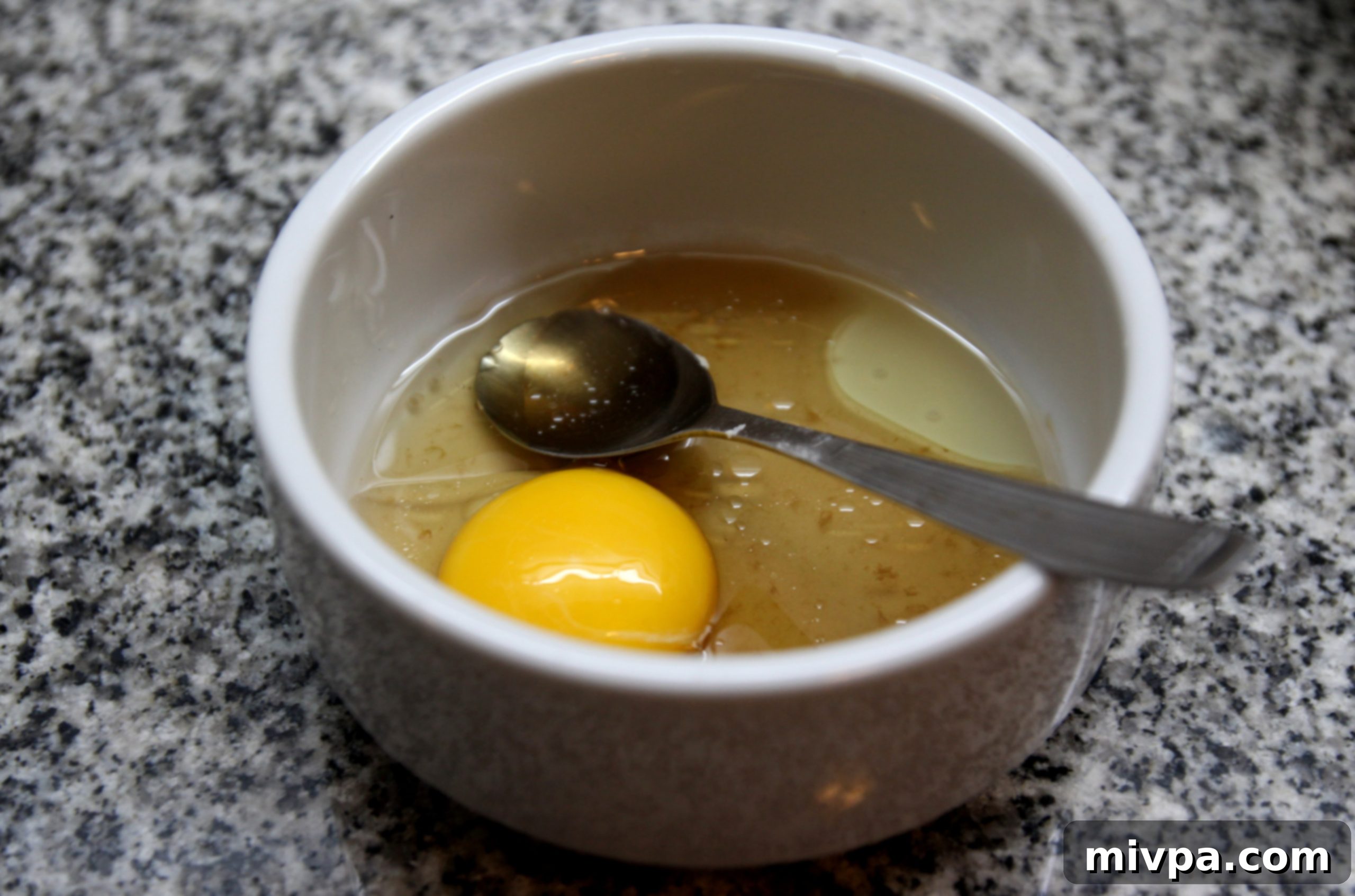 Mixing wet ingredients for pineapple tart dough