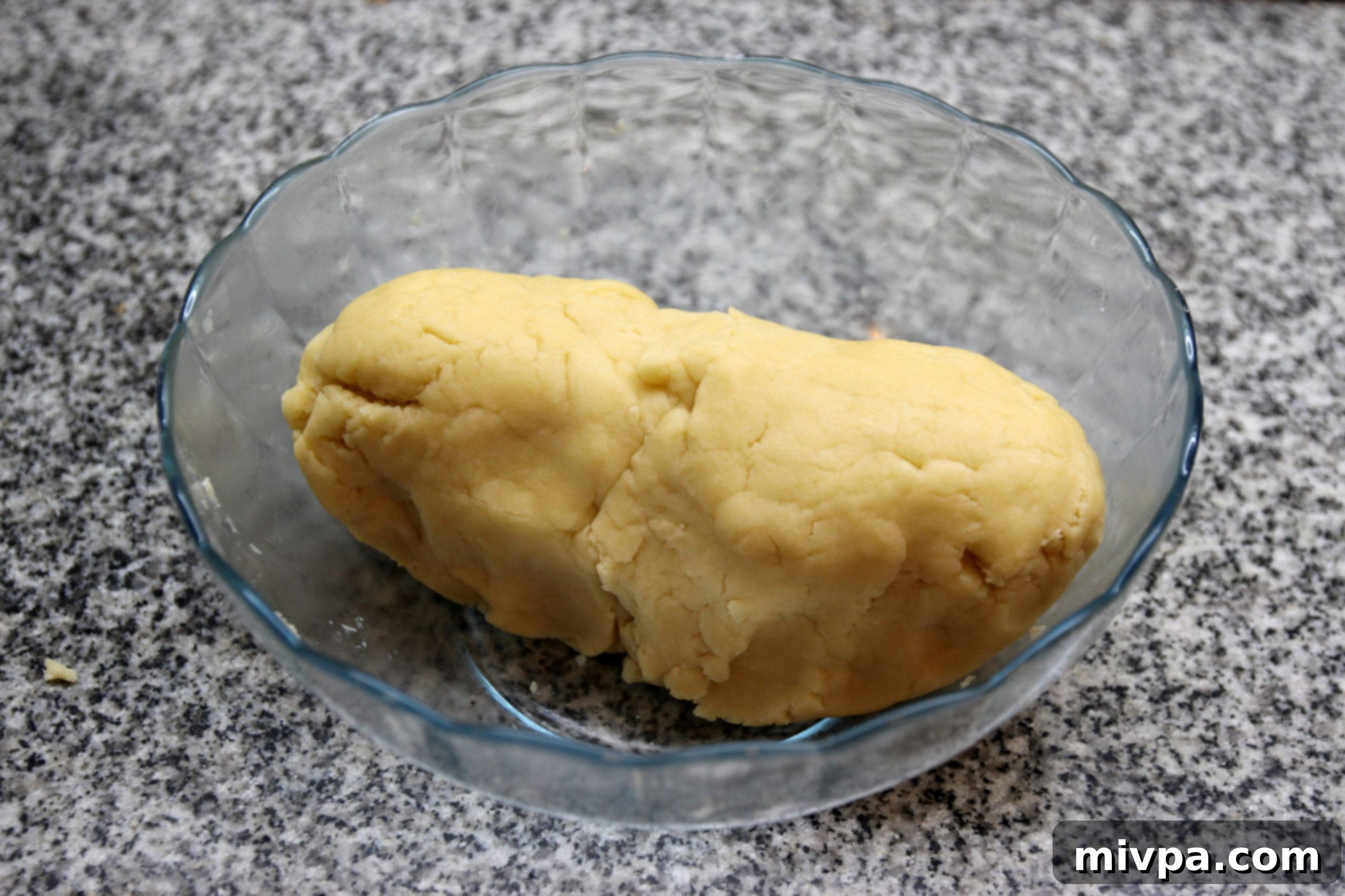 Kneading flour and wet ingredients into smooth dough