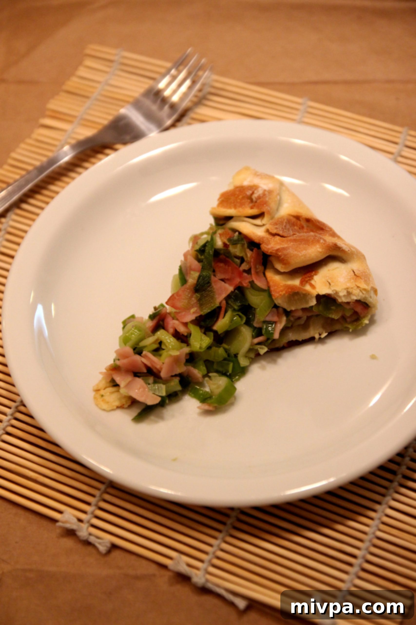 Freshly baked Leek and Ham Tart, golden brown and inviting