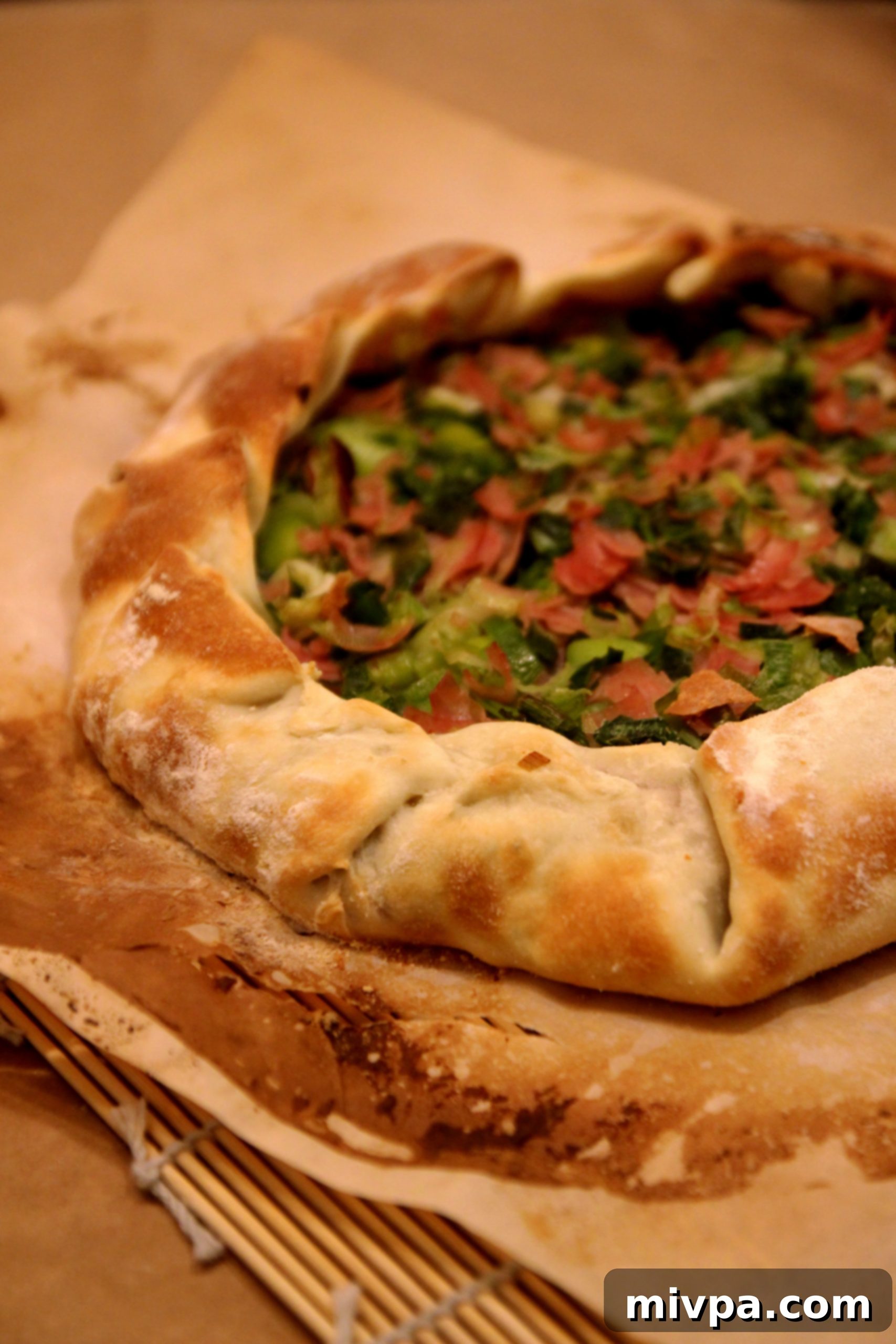 A large slice of homemade Leek and Ham Tart