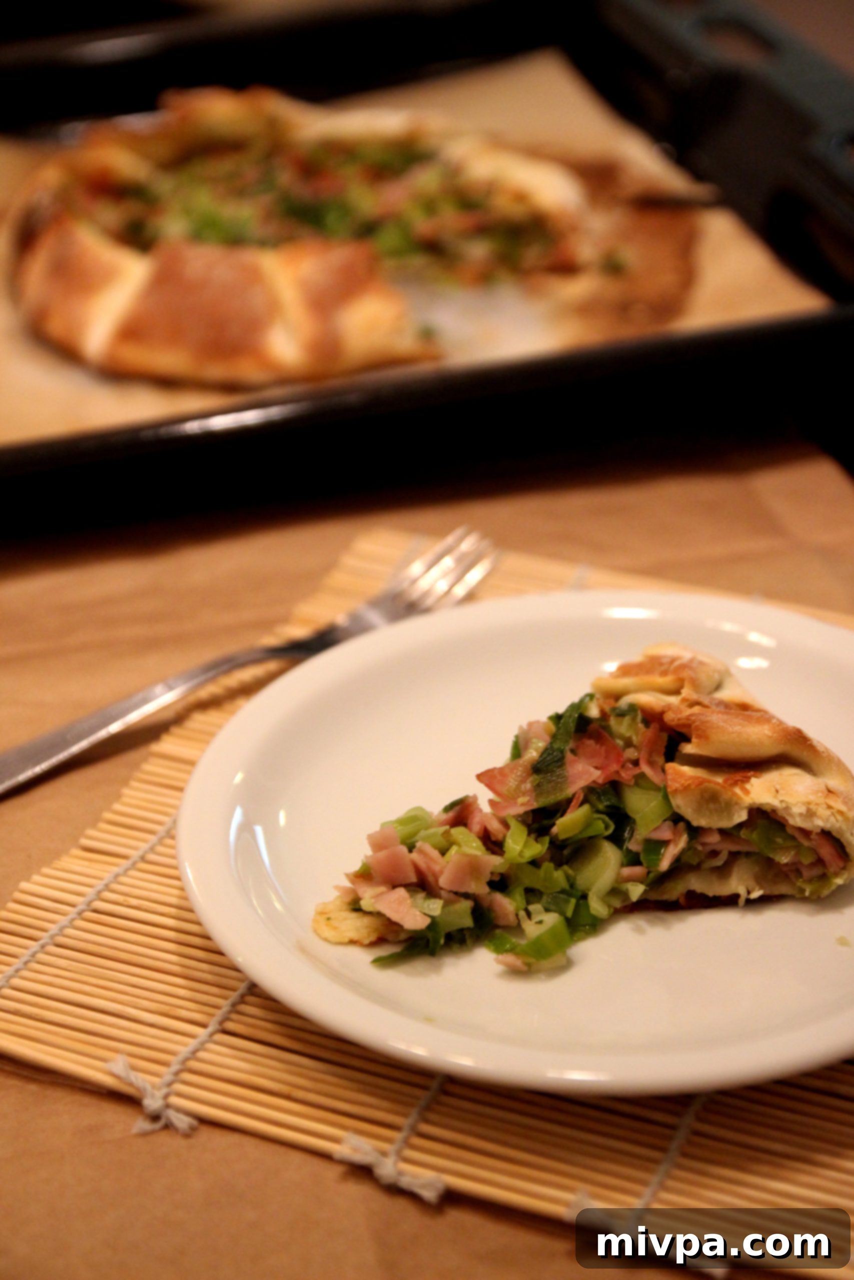 Ingredients for Leek and Ham Tart: Sliced leeks, ham, and pie crust