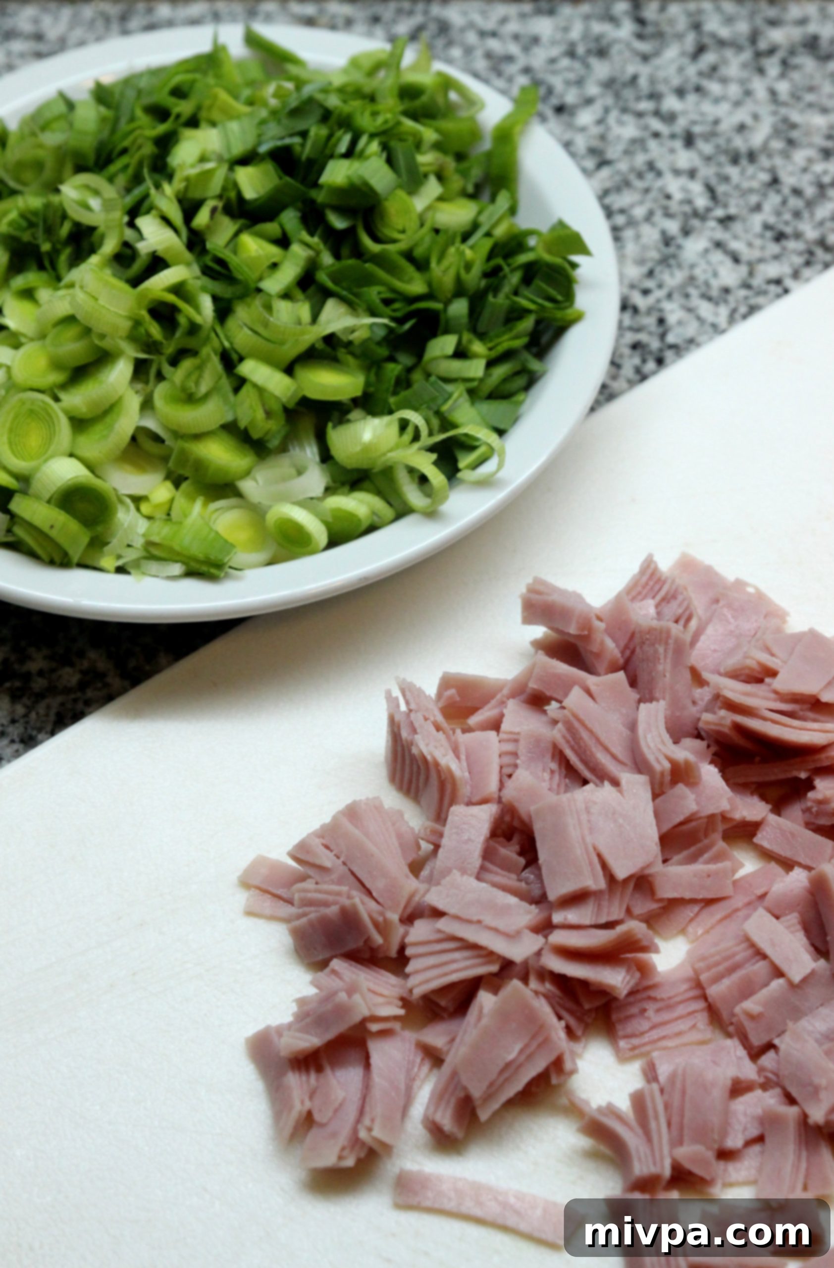 Assembling the Leek and Ham Tart on parchment paper