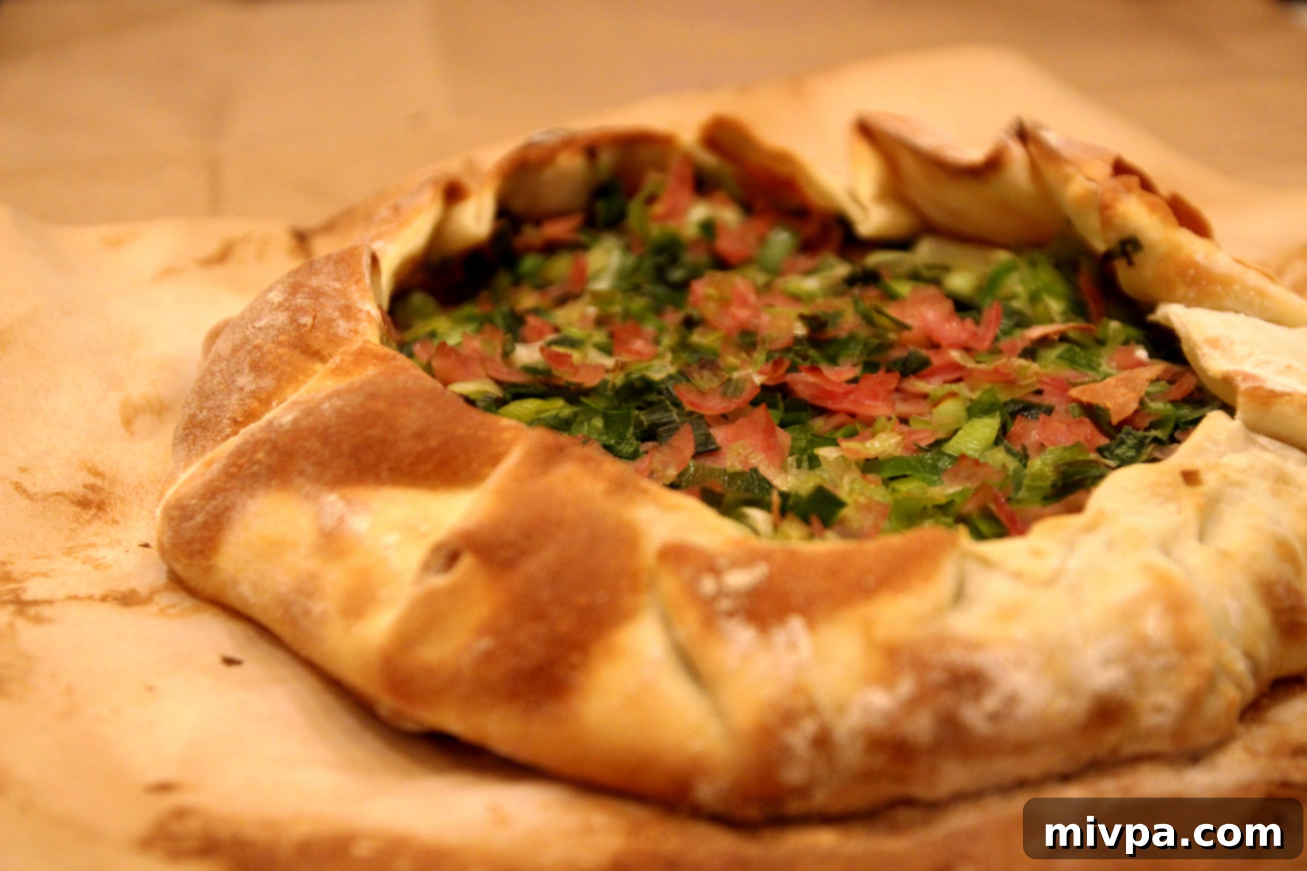 Leek and ham mixture placed on pie crust