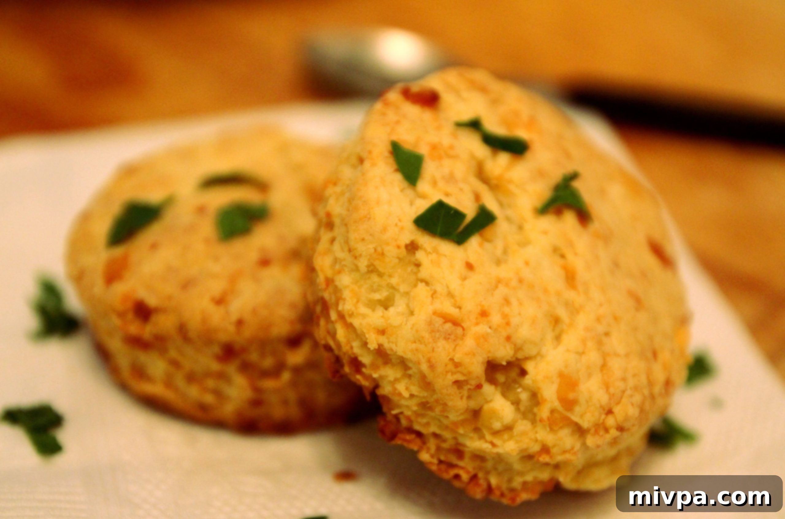 Freshly baked golden brown Cheddar Cheese Scones on a baking tray