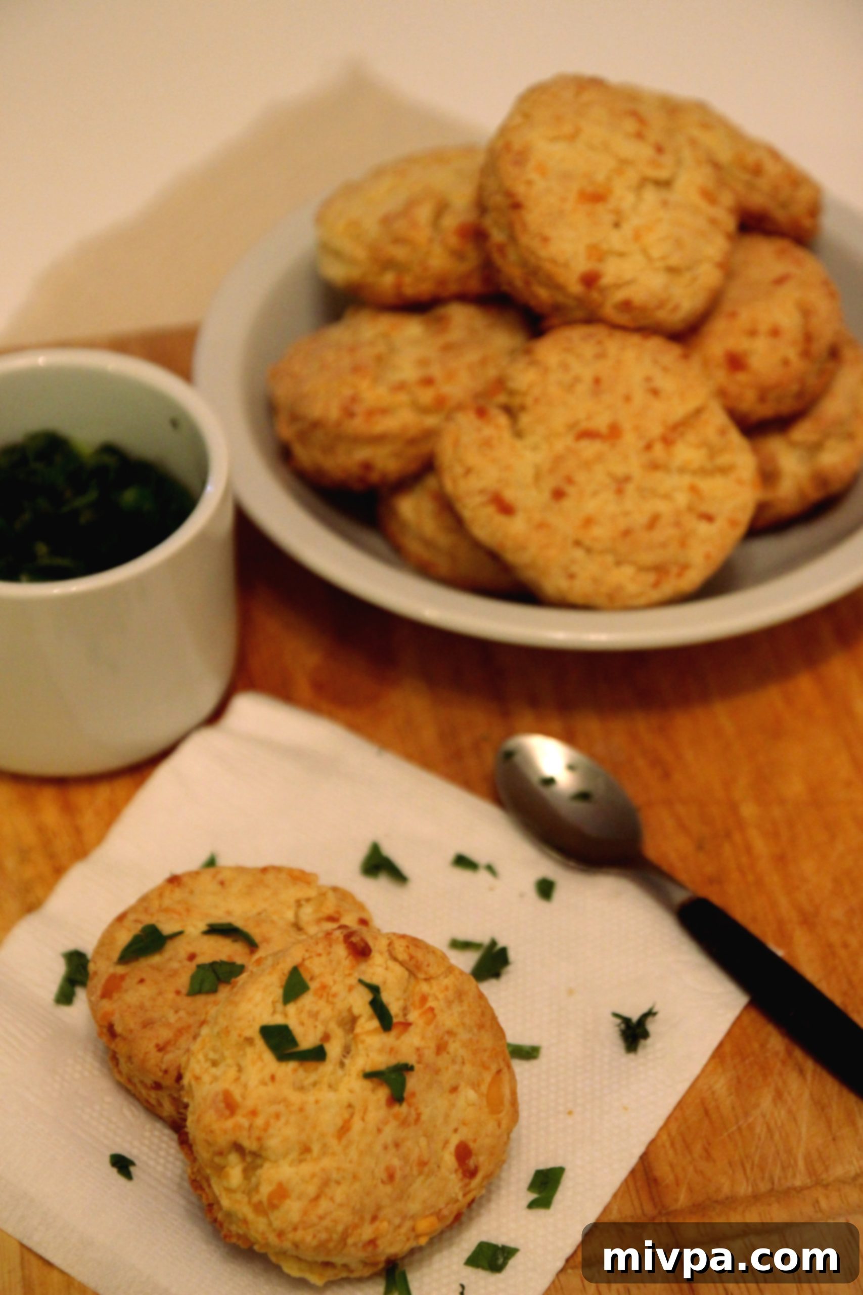 Plated Cheddar Cheese Scones with cream cheese and herbs