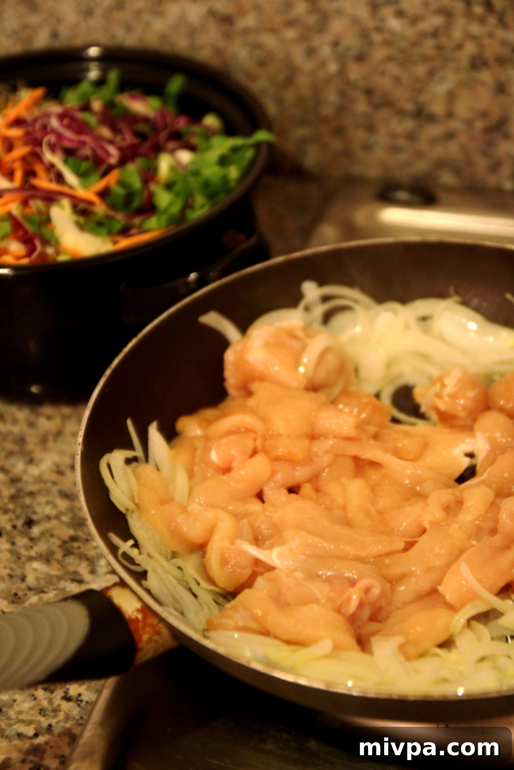 Frying eggs for the Asian-Style Chicken & Vegetable Rice Noodles recipe