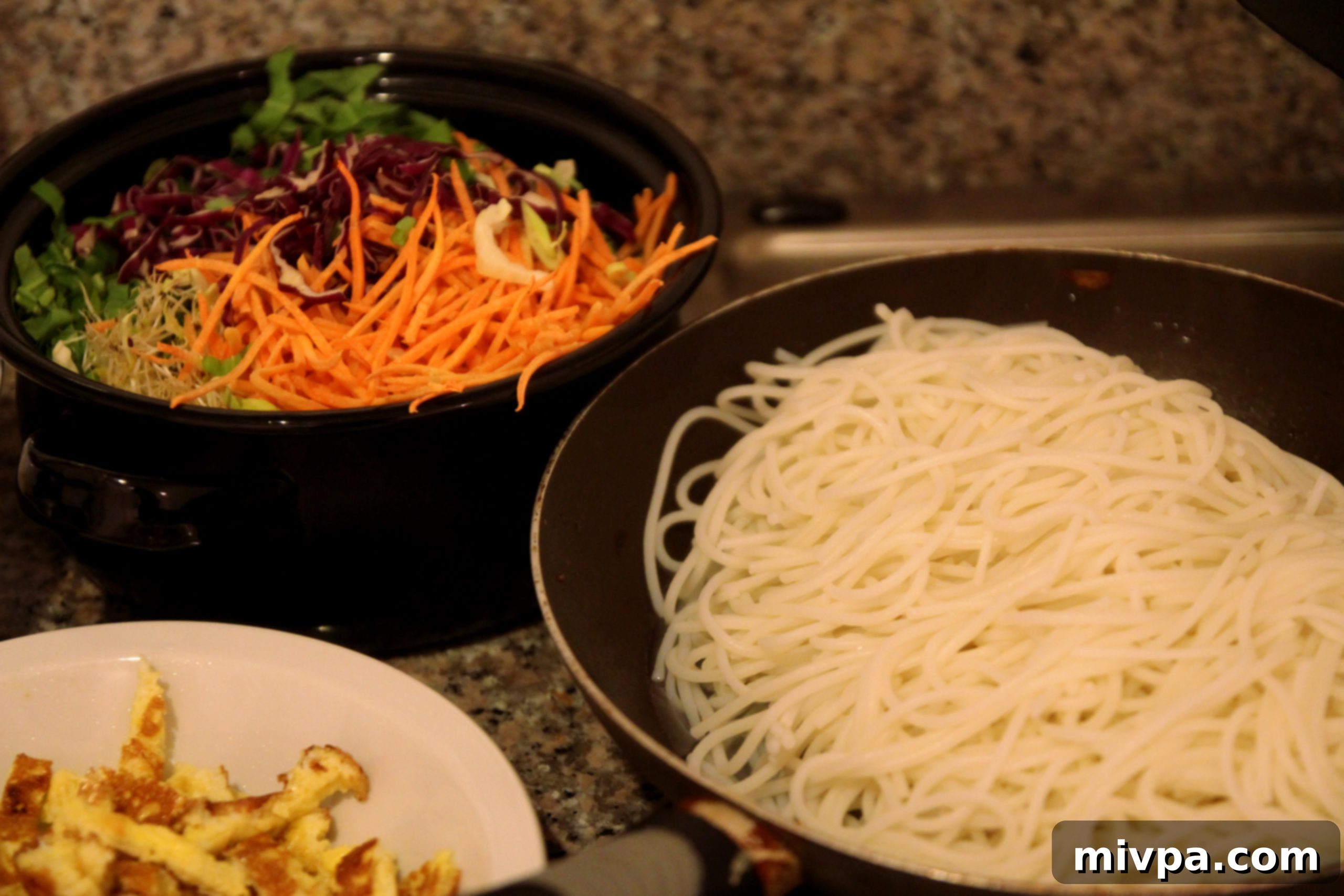 Step 6: Cooking rice noodles in boiling water, then draining them