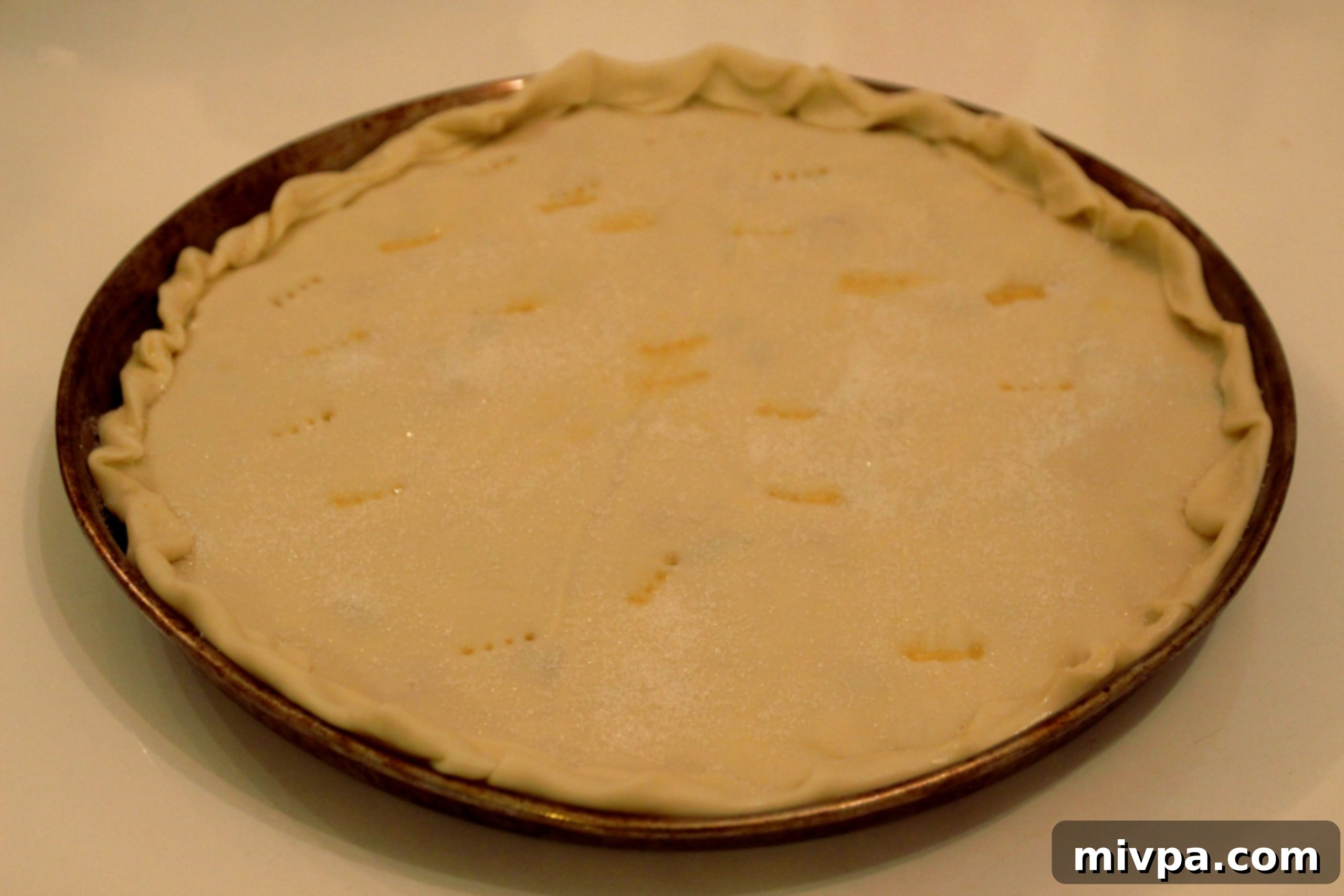 Covering tart with second shell and preparing for bake