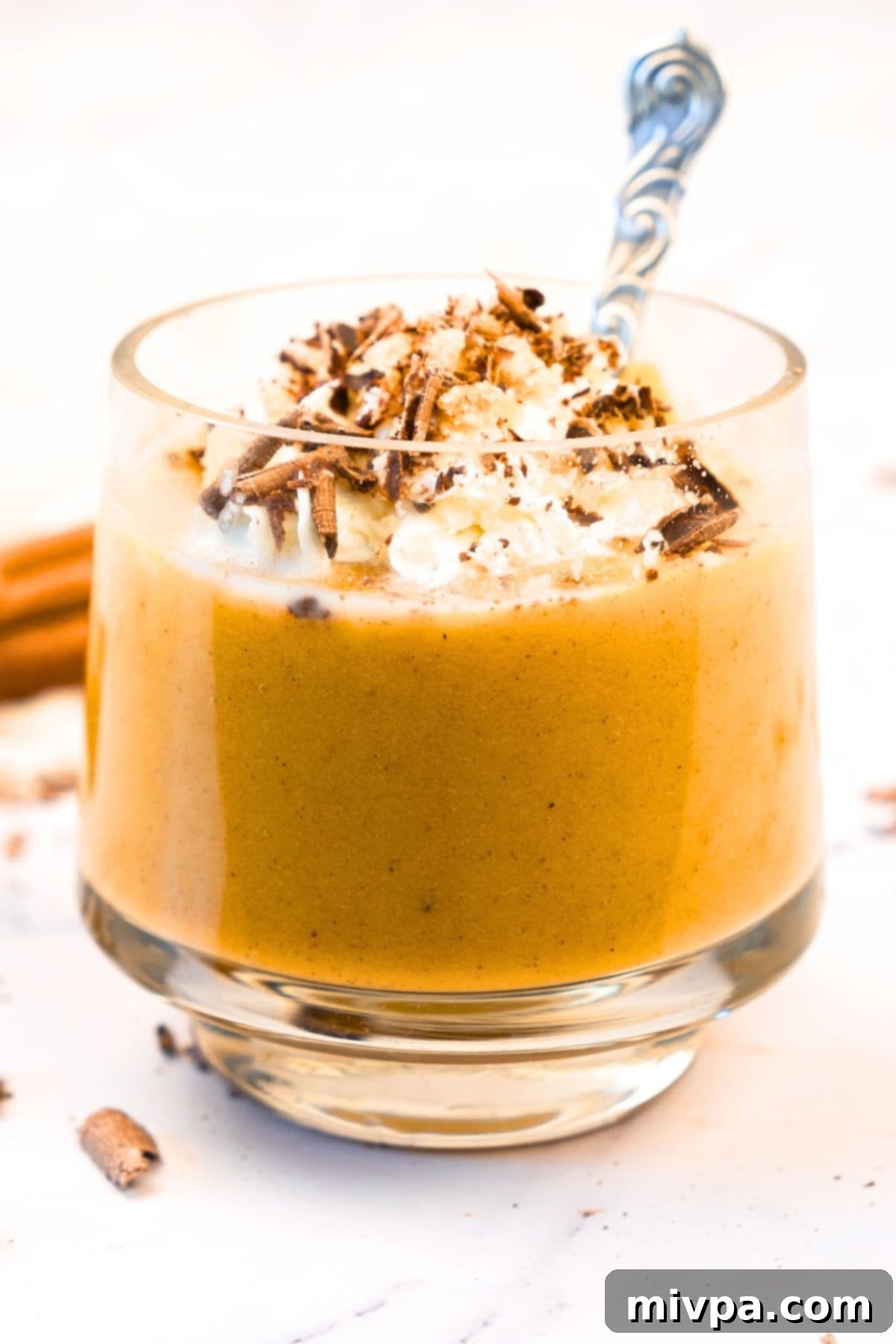 Creamy Pumpkin Pudding (Gluten-Free, Dairy-Free) Up close shot of a glass of pumpkin pudding, showcasing its smooth, creamy texture.