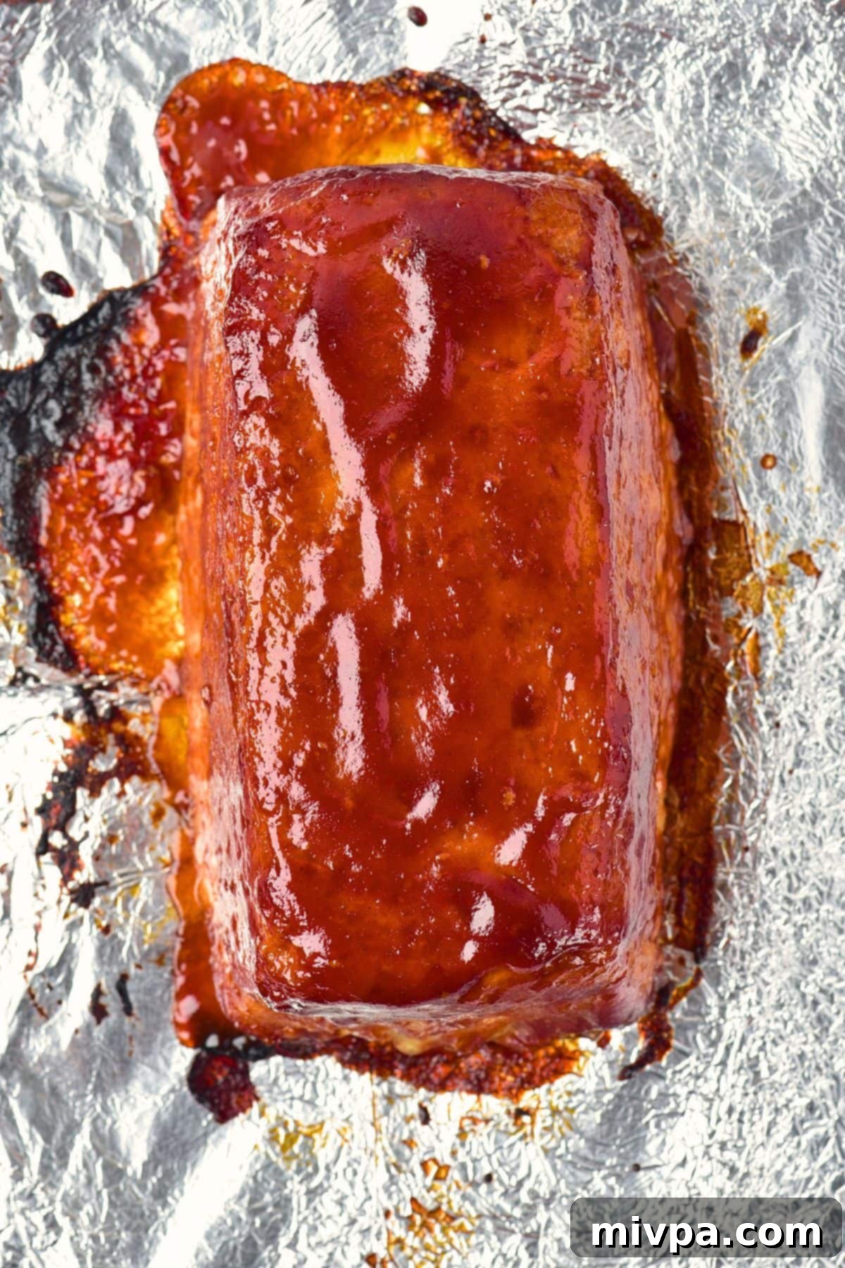 No-Fuss Gluten-Free Dairy-Free Chicken Meatloaf 3 Freshly baked meatloaf on aluminum foil