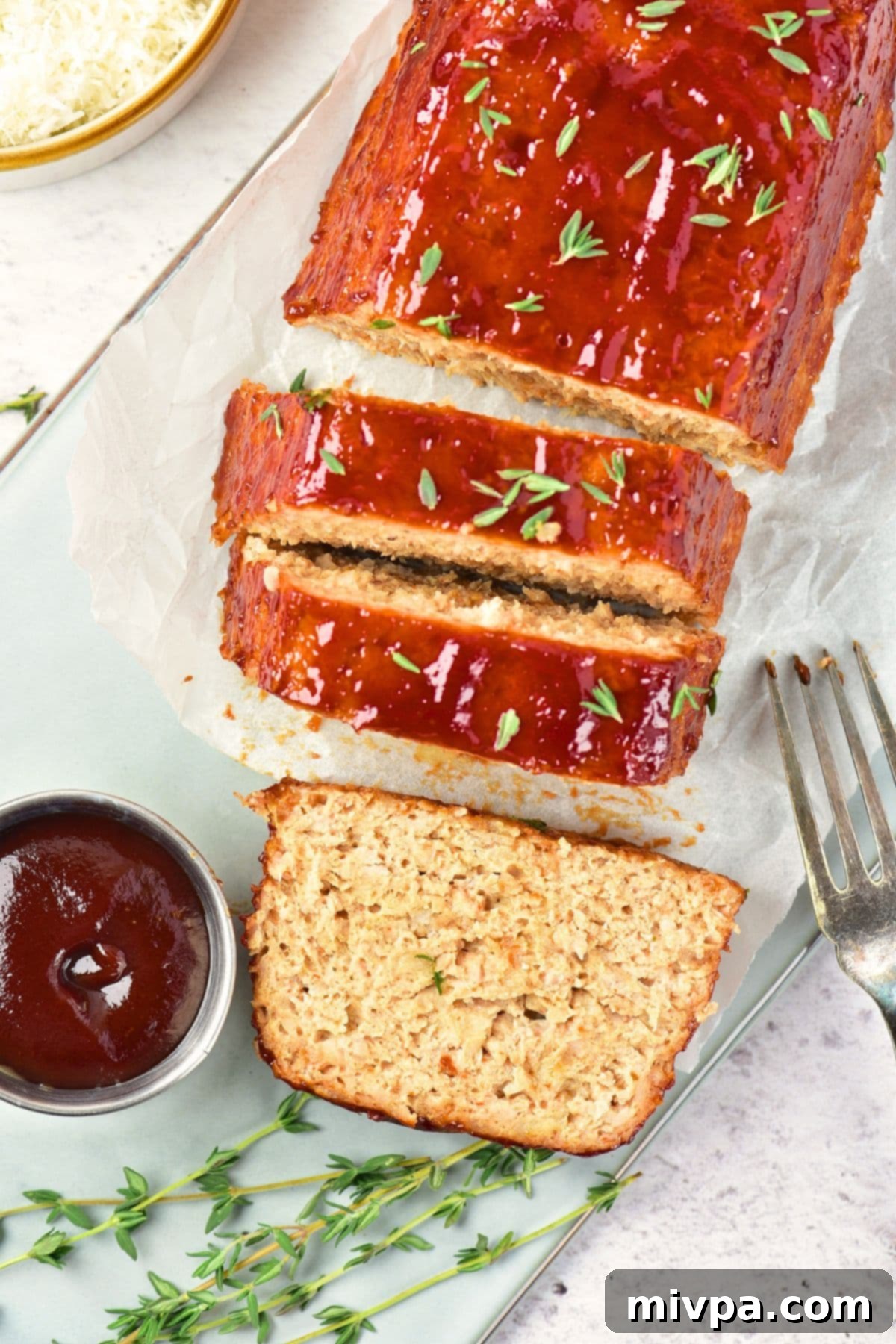 How to make Chicken Meatloaf Recipe Sliced meatloaf on parchment paper