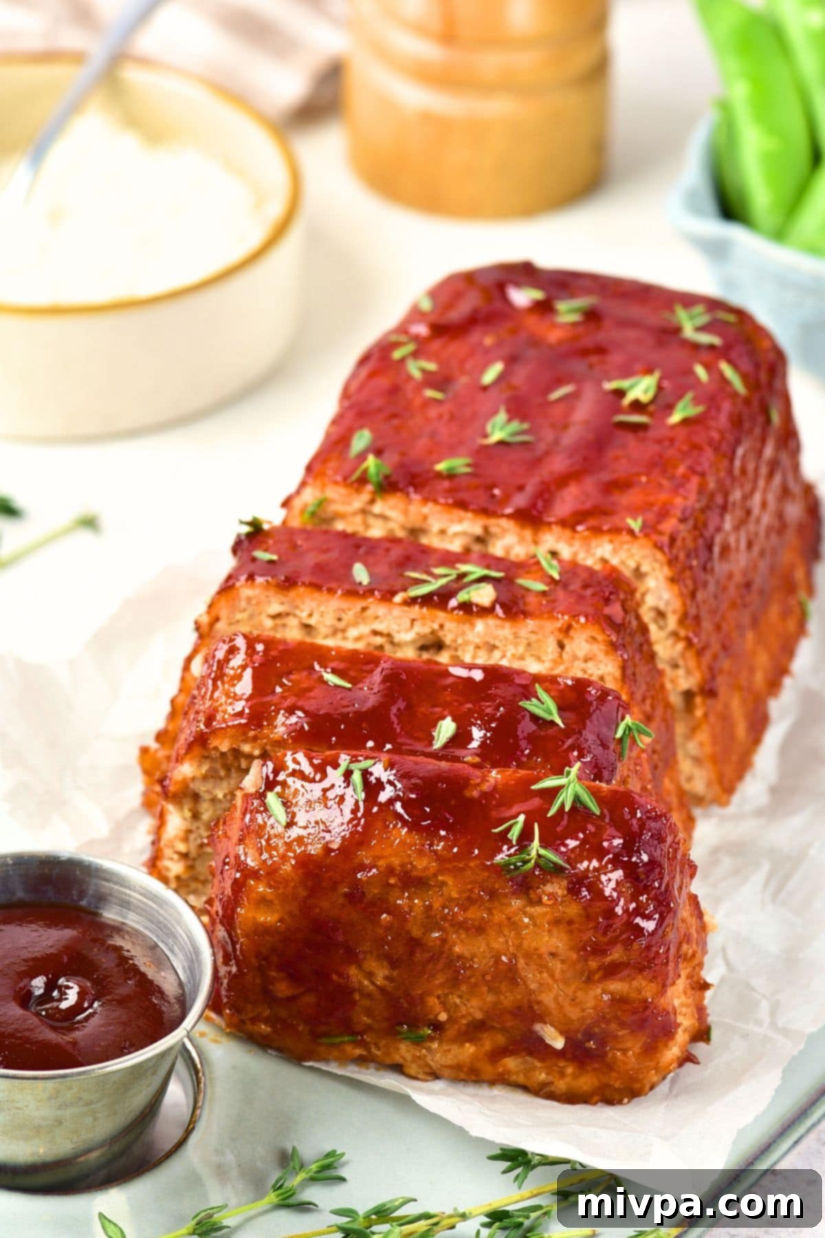 Ground Chicken Meatloaf (Gluten-Free, Dairy-Free) Ground chicken meatloaf topped with fresh thyme leaves