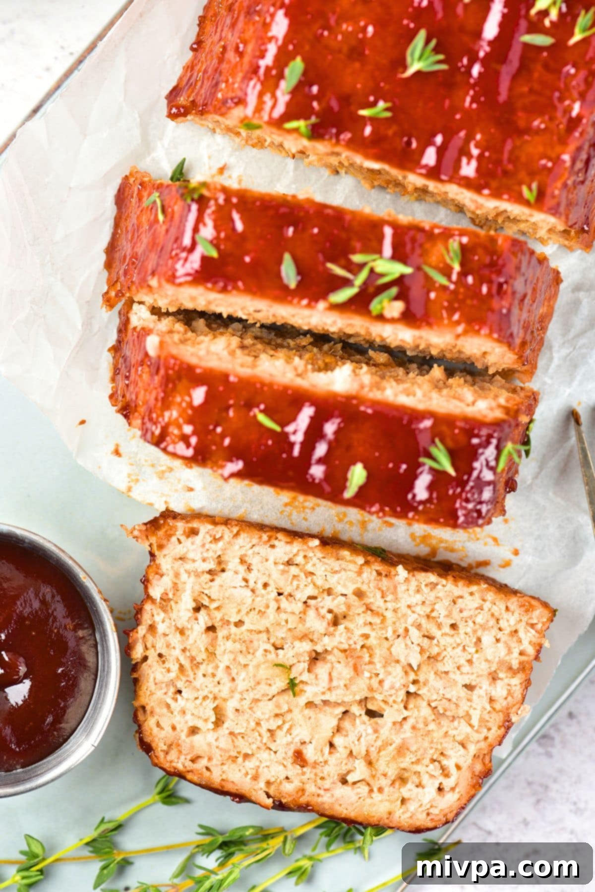Easy Chicken Meatloaf (Gluten-Free, Dairy-Free) Top down view of a sliced meatloaf