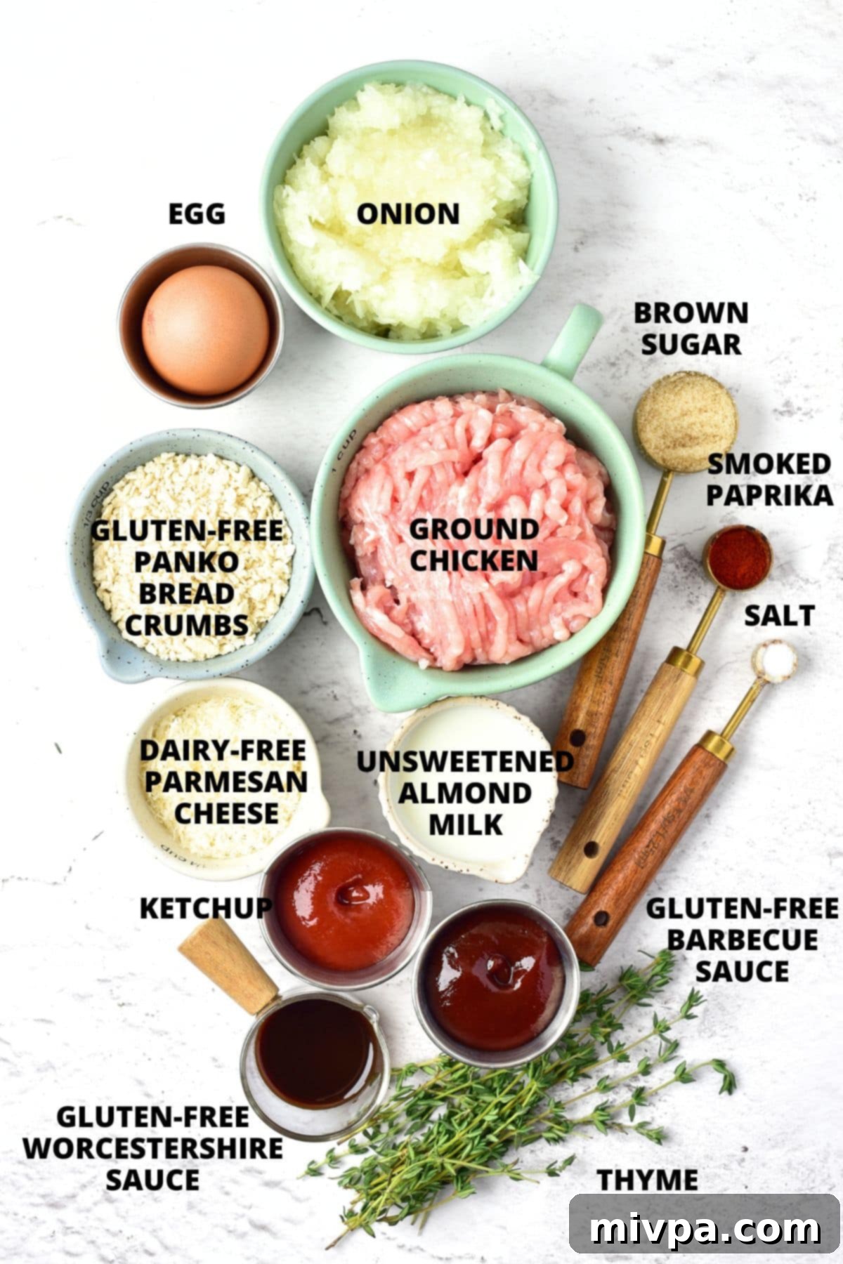 Easy Chicken Meatloaf Recipe (Gluten-Free, Dairy-Free) Ingredients for chicken meatloaf recipe laid out on marble board.