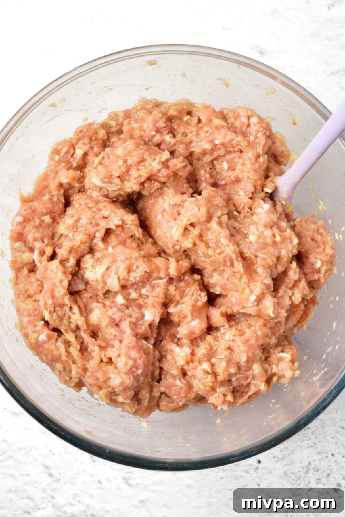 Meatloaf with Chicken Ground chicken mixture in glass bowl