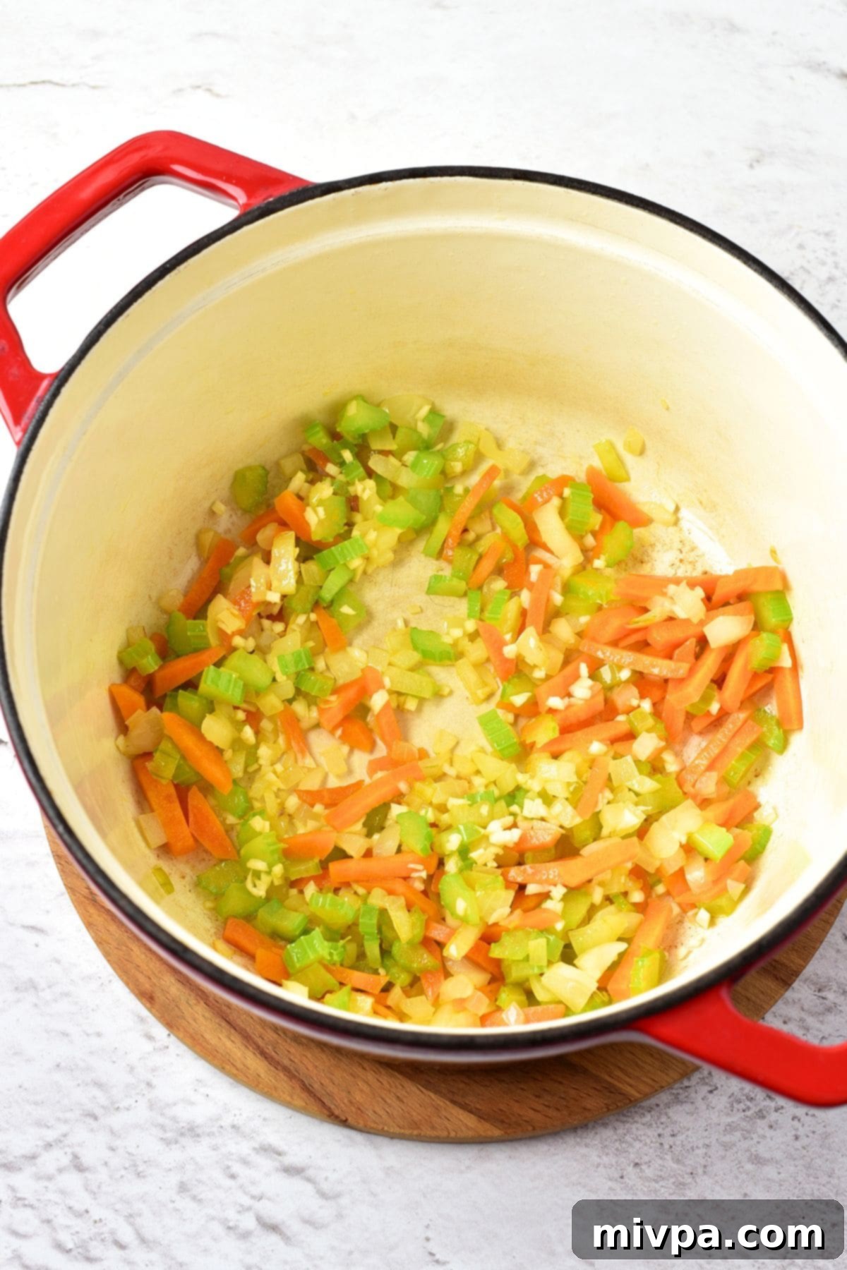 How to Make Chicken Wild Rice Soup Sautéed carrots, celery, onions and garlic in a Dutch oven, forming the aromatic base for the soup.