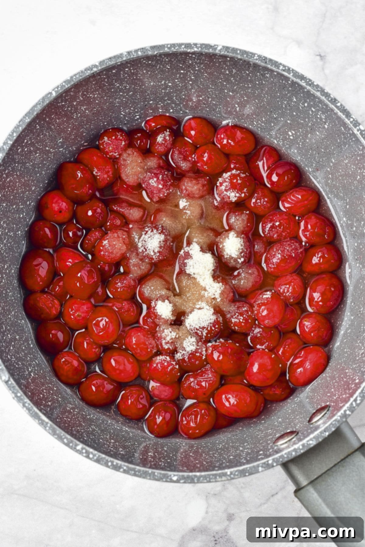Cranberry Meatballs (Gluten-Free, Dairy-Free) Cooking cranberries in saucepan