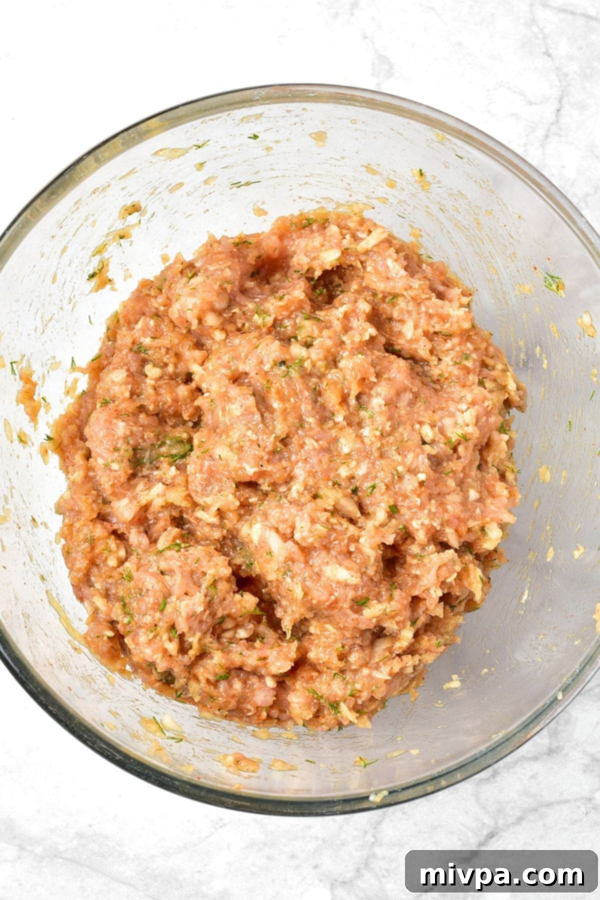 Easy Cranberry Meatballs Meatball mixture in glass bowl