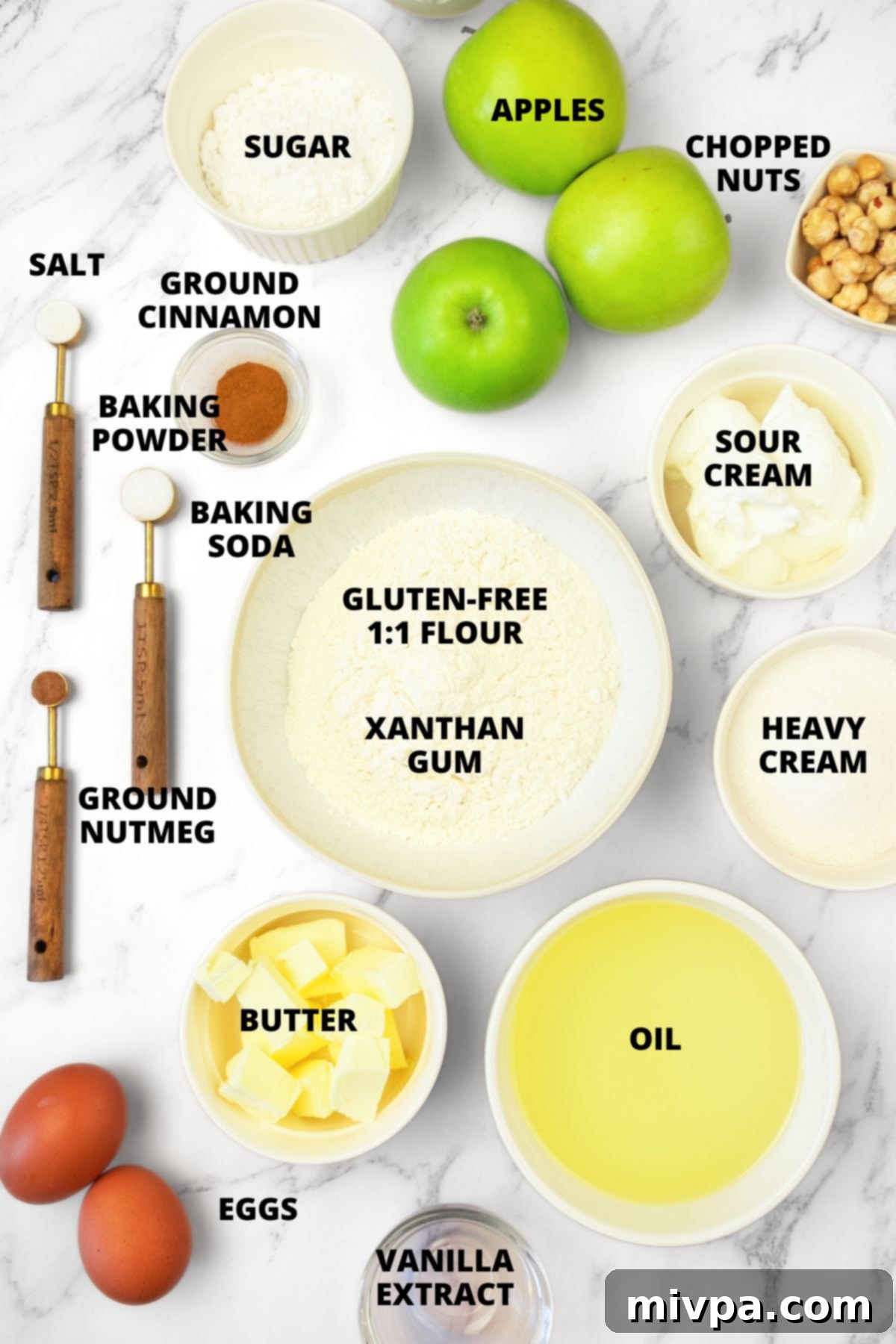 Ingredients for Swedish Apple Cake (Gluten-Free, Dairy-Free) All ingredients for the Swedish apple cake recipe neatly laid out on a marble board, ready for preparation.