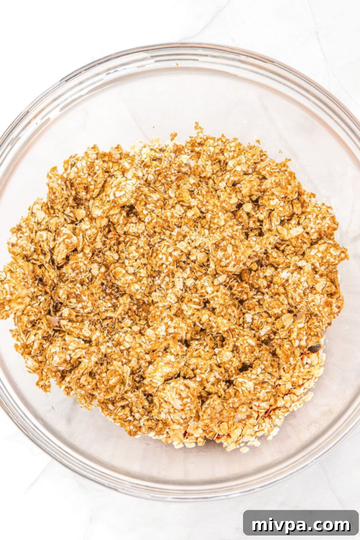 No Bake Peanut Butter Oatmeal Balls (Gluten-Free, Vegan) Oatmeal mixture in glass bowl