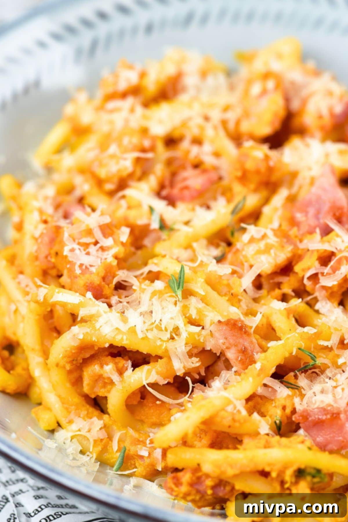 Luxurious Gluten and Dairy Free Pumpkin Carbonara 3 Up close view of a beautiful bowl of pumpkin spaghetti carbonara ready to serve.