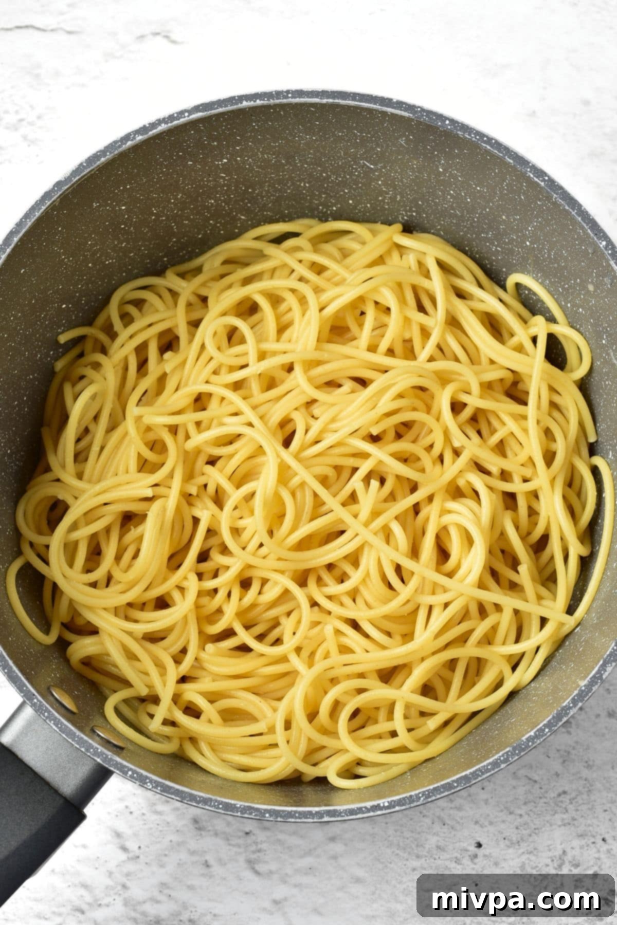 Gluten Dairy-Free Pumpkin Pasta Carbonara Step 1 Cooked gluten-free spaghetti in a large pot, steaming gently.