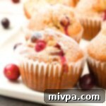 Up close shot of cranberry orange muffins on plate