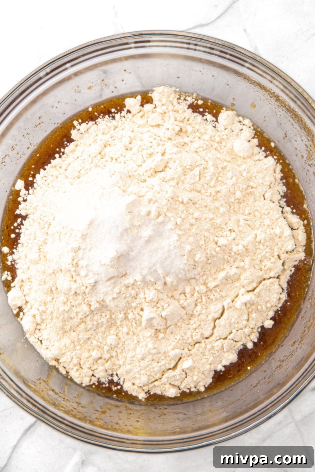 Brown Butter Pecan Chocolate Chip Cookies (Gluten-Free) Dry ingredients (flour, xanthan gum, salt, baking powder) added on top of the wet mixture.