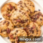 A plate of pecan chocolate chip cookies