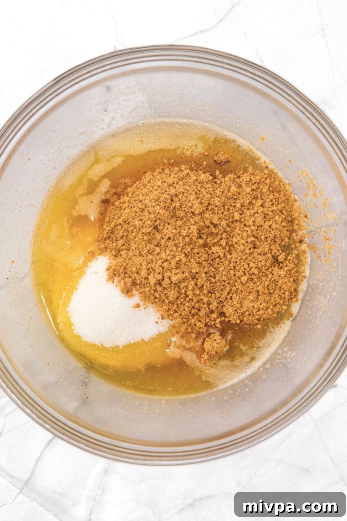 Gluten-Free Chocolate Chip and Pecan Cookies Beautifully browned butter and sugars being mixed together in a bowl.