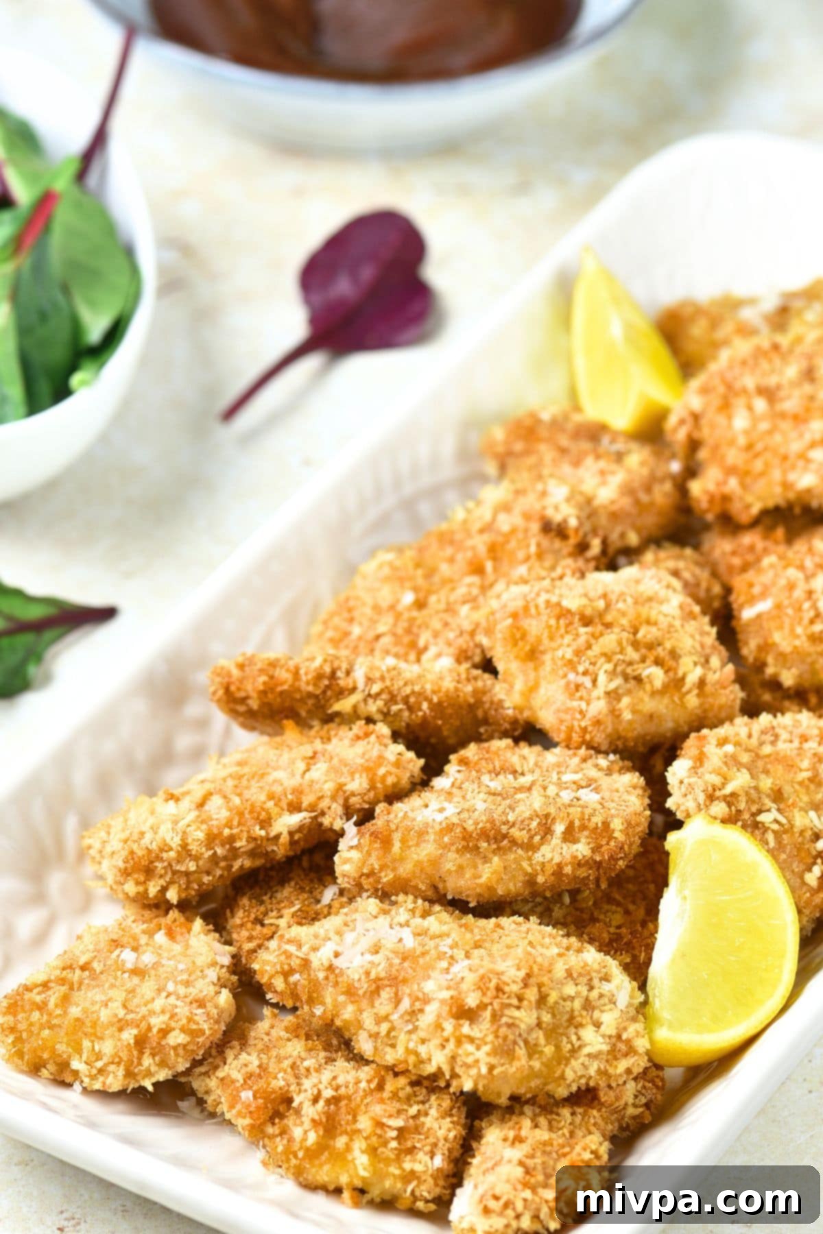 Gluten-Free Turkey Nuggets Recipe Gluten-free turkey nuggets arranged on a plate with dipping sauce.