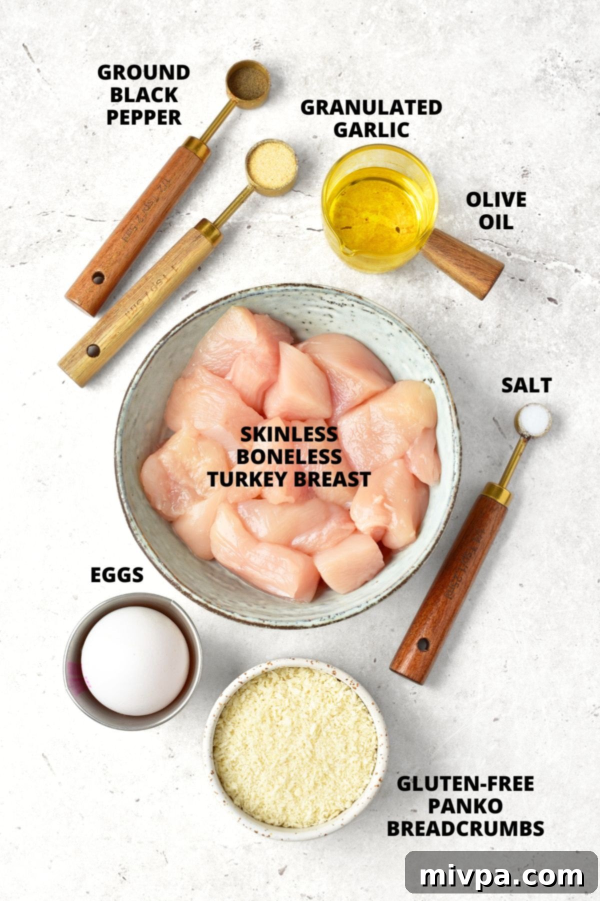 Homemade Turkey Nuggets Recipe (Gluten-Free, Dairy-Free) Ingredients for homemade turkey nuggets recipe laid out on marble board.