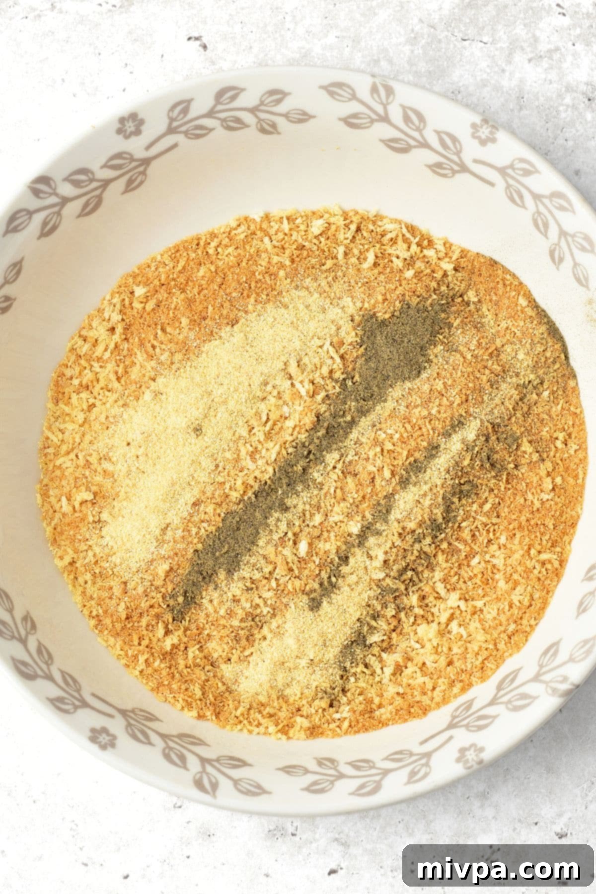 Homemade Nuggets with Turkey Meat Breadcrumb mixture in a bowl, seasoned with spices.