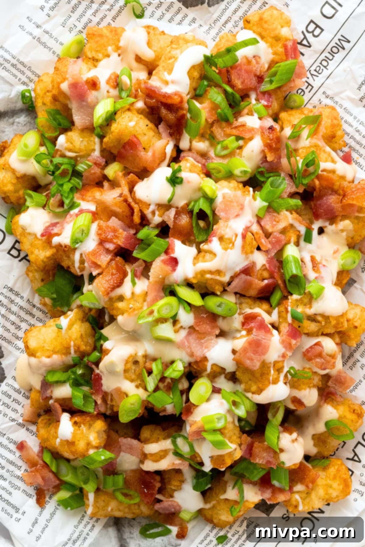 Gluten Free Tater Tots with Green Onions and Bacon Top down view of tater tots garnished with bacon and green onions