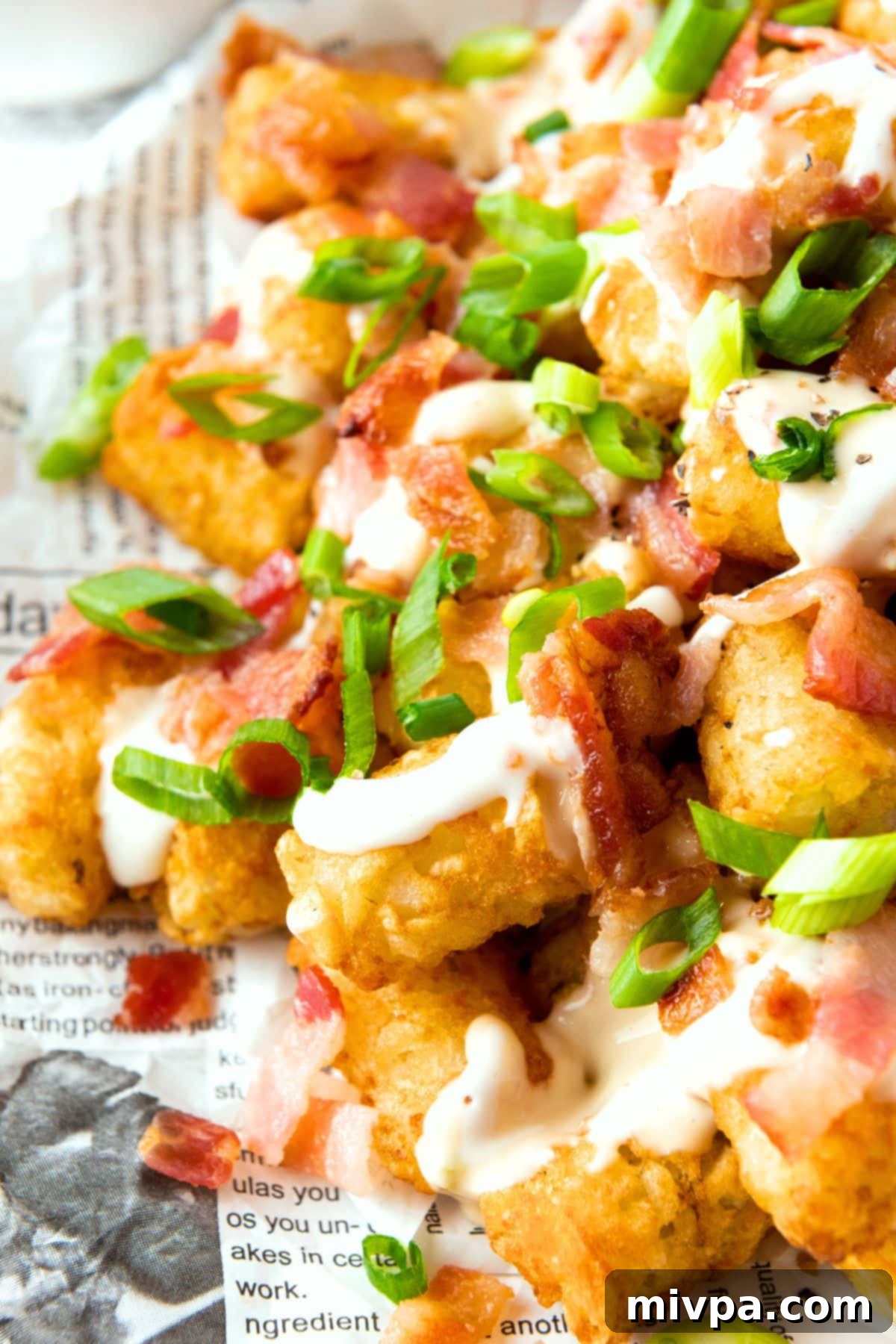 Fully Loaded Tater Tots (Gluten-Free) Up close view of fully loaded tater tots