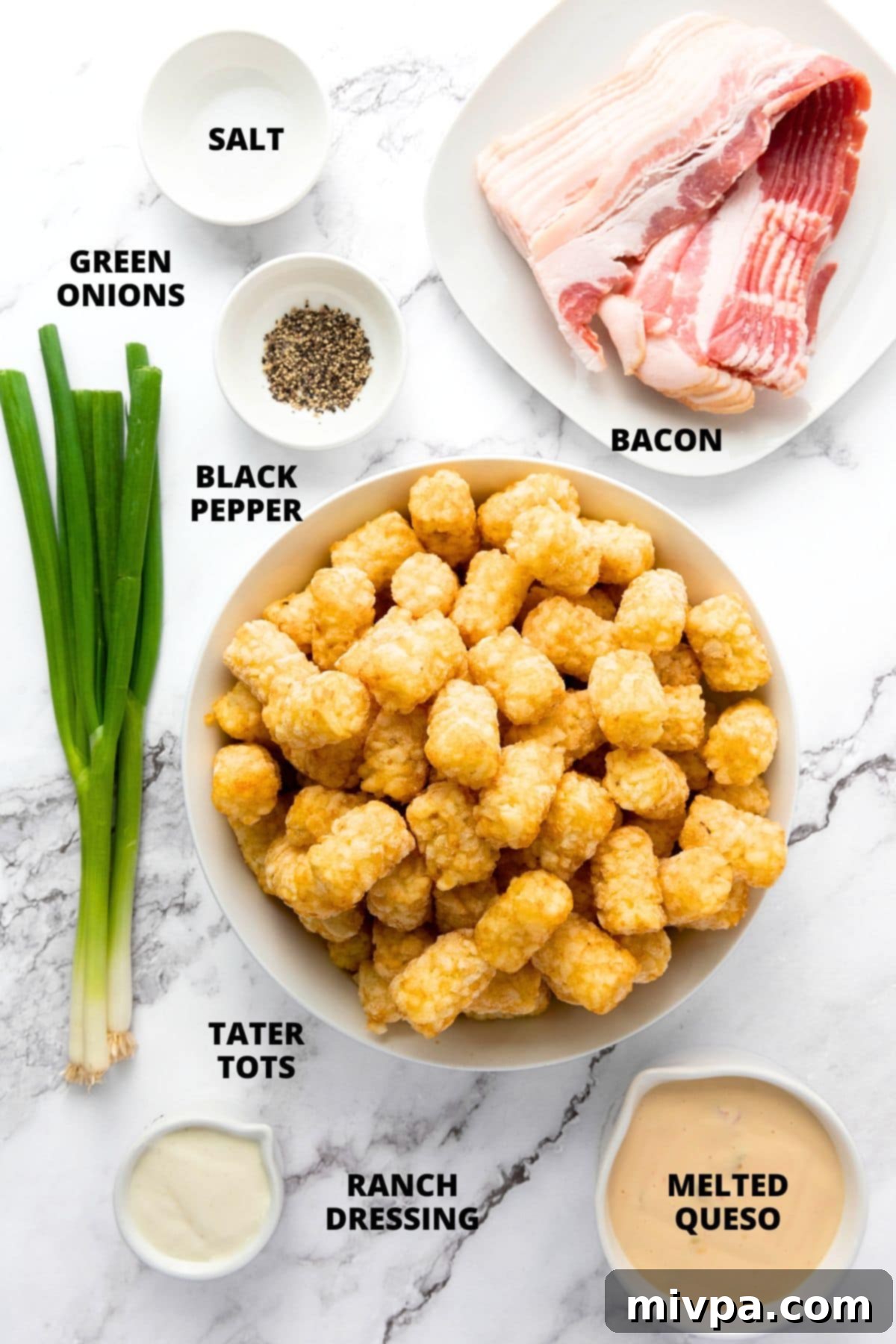 Loaded Tater Tots Recipe (Gluten-Free) Ingredients of loaded tater tots recipe laid on marble board.