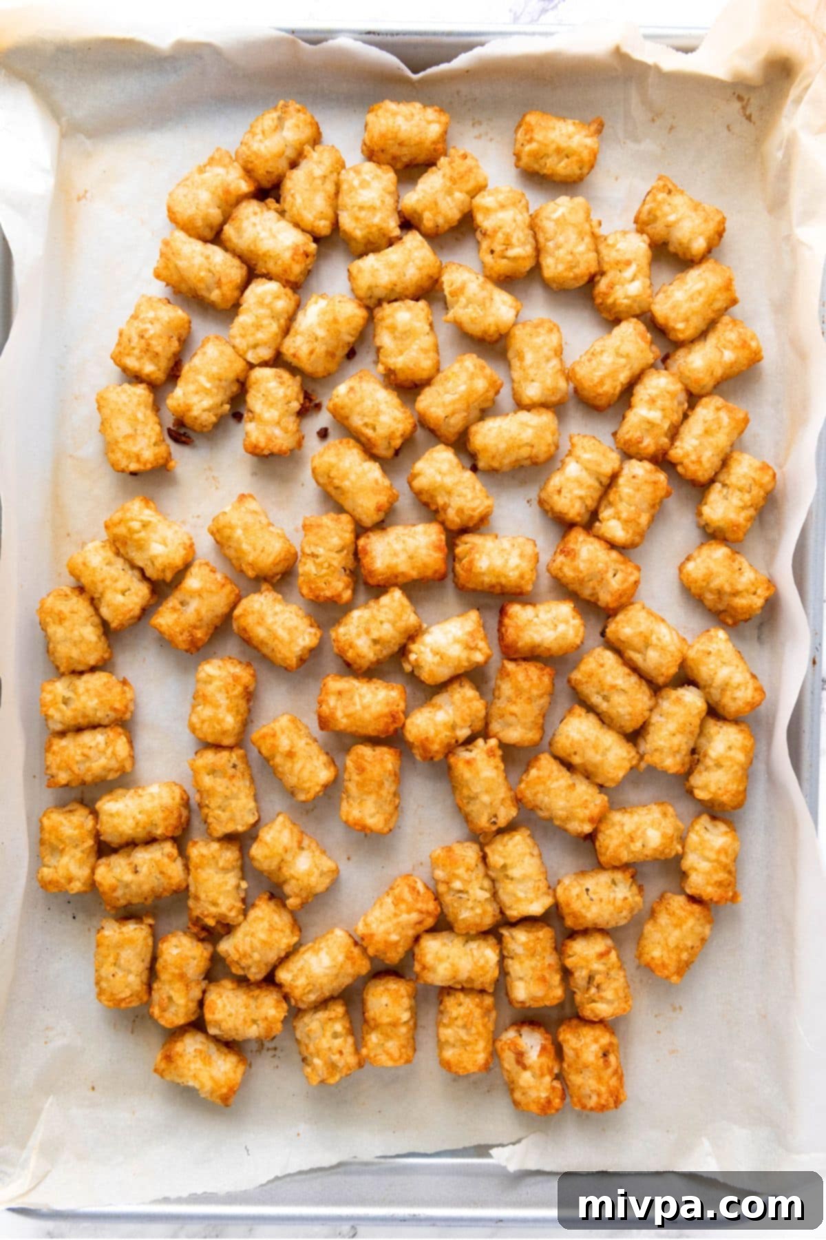 Gluten-Free Tater Tots Crispy tater tots on parchment